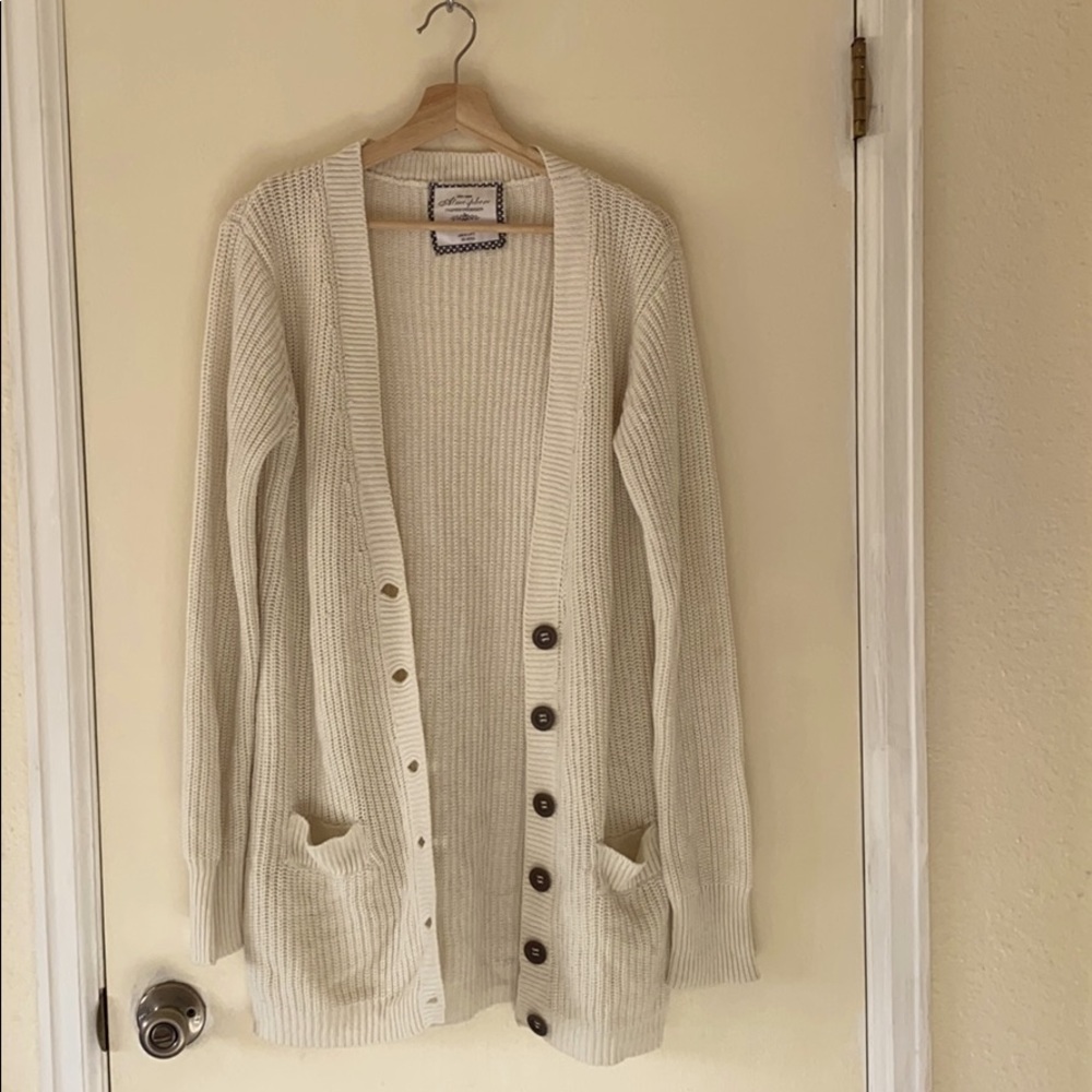 Oversized cream cardigan with brass buttons